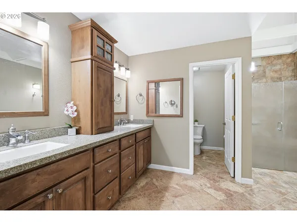 a bathroom with a bathtub and shower