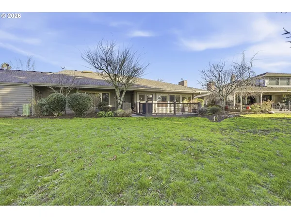 a view of a house with sitting area and garden