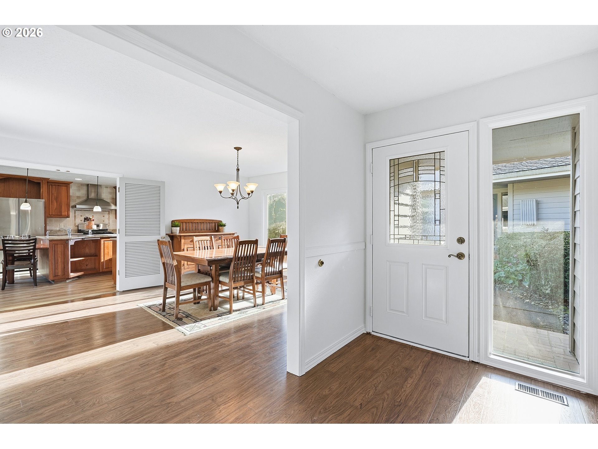 32565 Southwest Lake Point Court Wilsonville, OR 97070 - Photo 7 of 48 a living room with furniture and a dining table with wooden floor
