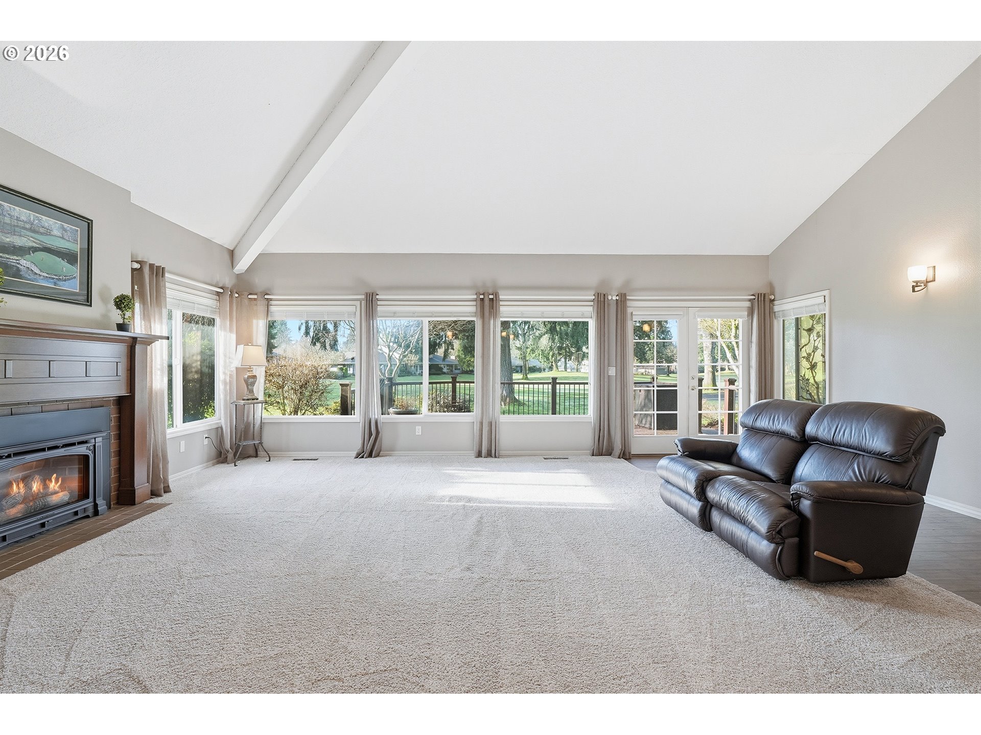 32565 Southwest Lake Point Court Wilsonville, OR 97070 - Photo 8 of 48 a living room with furniture and a fireplace