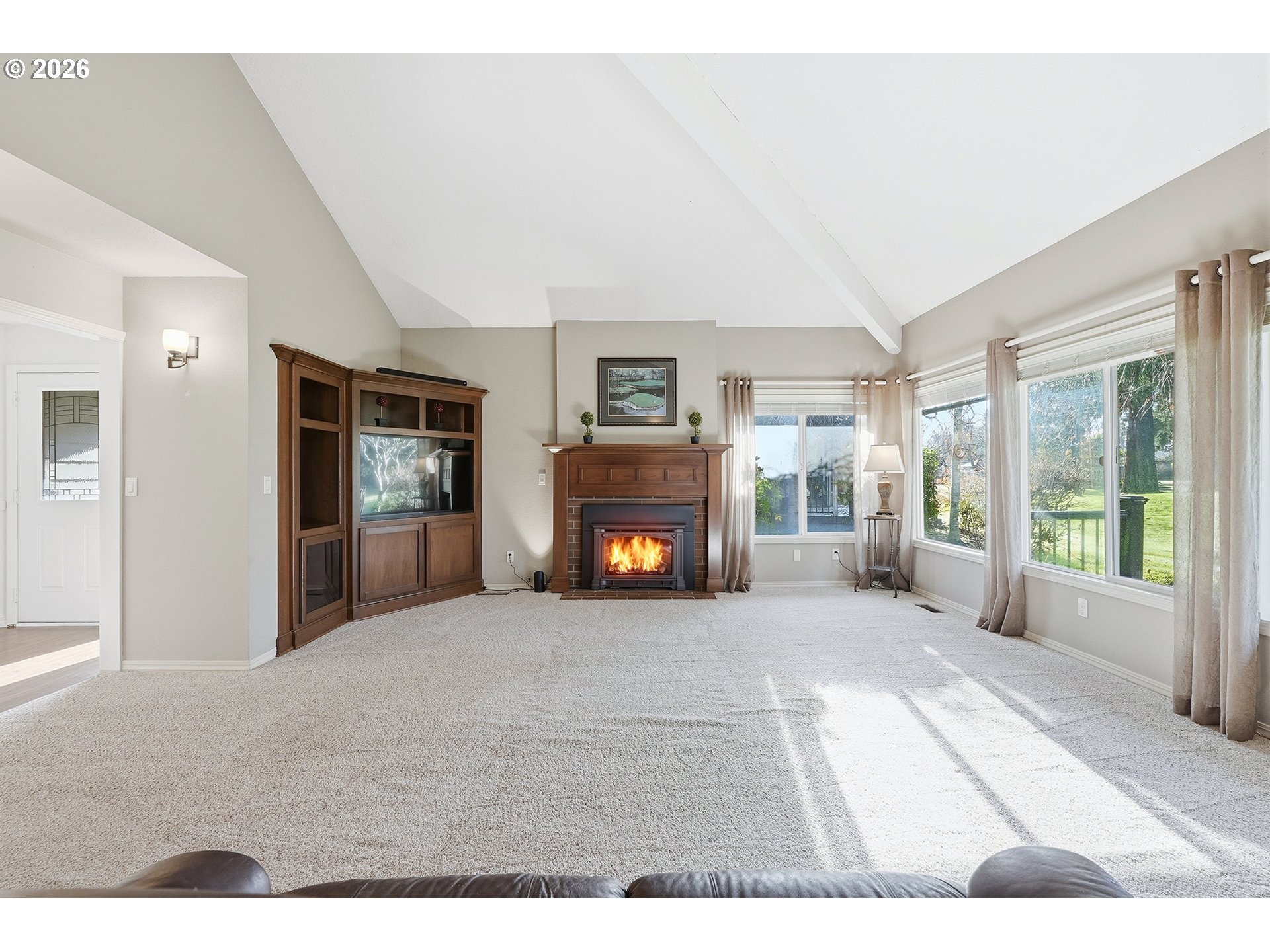 32565 Southwest Lake Point Court Wilsonville, OR 97070 - Photo 10 of 48 a view of an empty room with a fireplace and a window