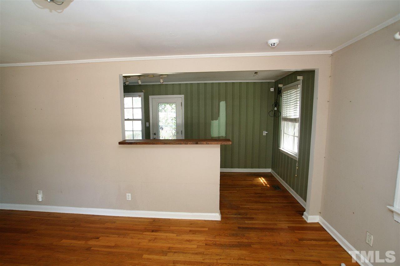 705 Mial Street Raleigh, NC 27608 - Photo 9 of 14 a view of a room with wooden floor and staircase