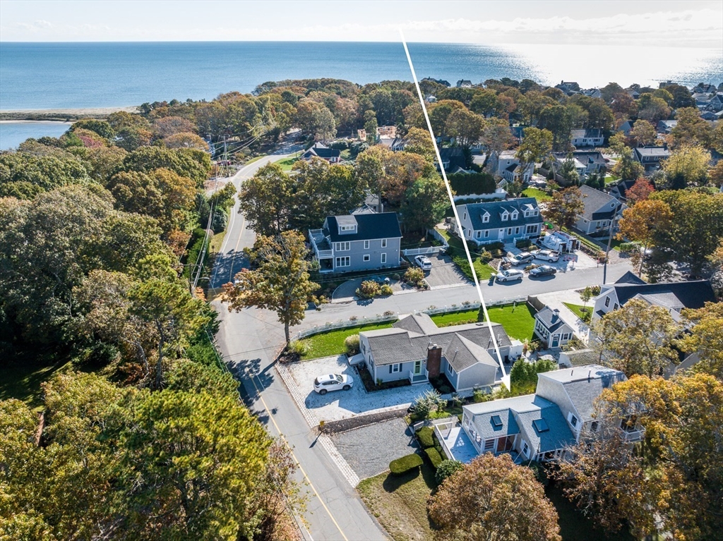 an aerial view of a house with a swimming pool outdoor seating and yard