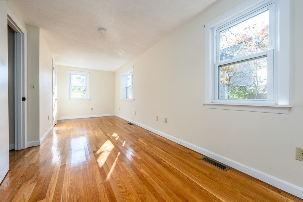 2 Uncle Percy's Road Mashpee, MA 02649 - Photo 13 of 32 a view of empty room with wooden floor and fan
