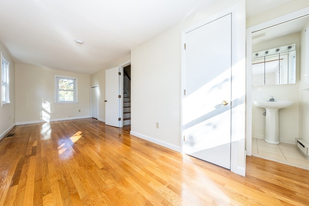 2 Uncle Percy's Road Mashpee, MA 02649 - Photo 14 of 32 a view of a bedroom with wooden floor and windows