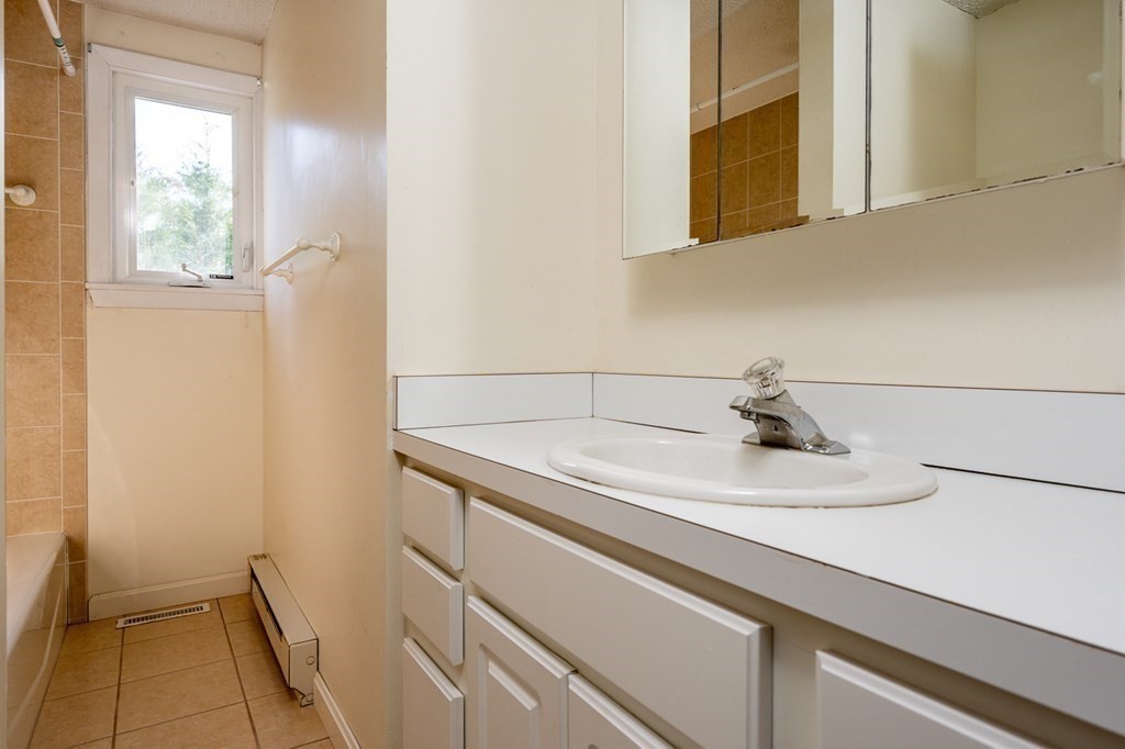 2 Uncle Percy's Road Mashpee, MA 02649 - Photo 17 of 32 a bathroom with a sink and a mirror