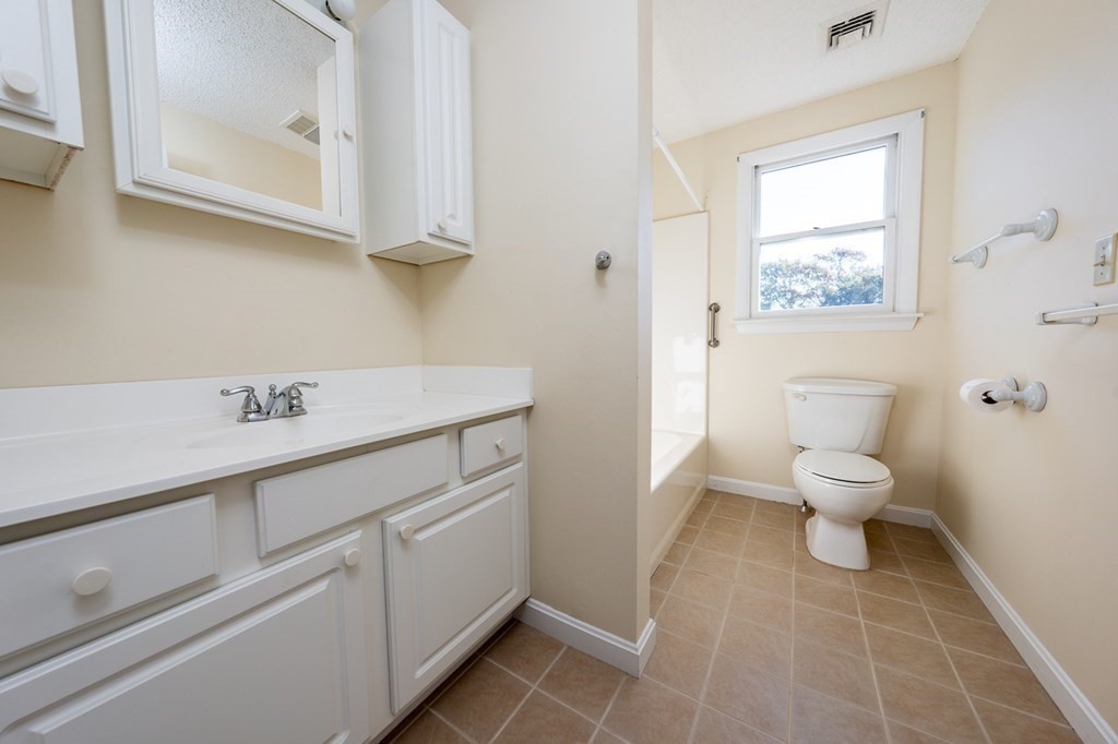 2 Uncle Percy's Road Mashpee, MA 02649 - Photo 23 of 32 a bathroom with a toilet sink and mirror
