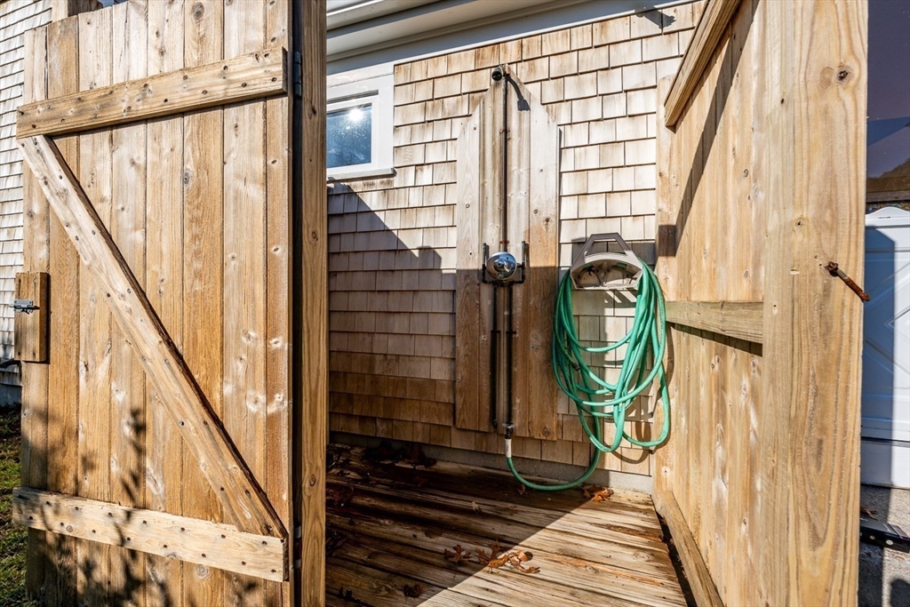 2 Uncle Percy's Road Mashpee, MA 02649 - Photo 24 of 32 a view of a balcony with wooden floor and door