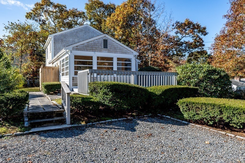 2 Uncle Percy's Road Mashpee, MA 02649 - Photo 4 of 32 a front view of a house with garden