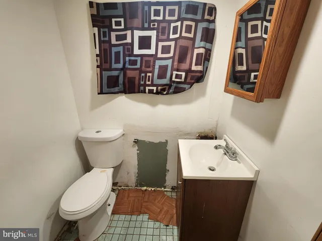 a bathroom with a toilet and a sink