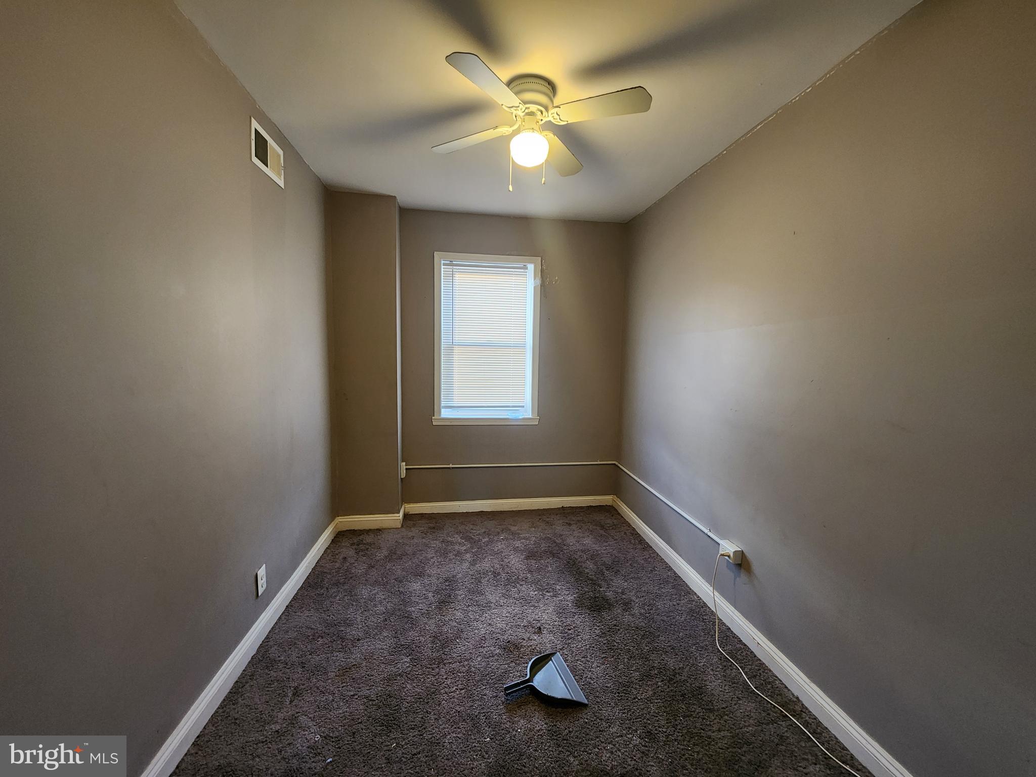 3213 Spaulding Avenue Baltimore, MD 21215 - Photo 19 of 26 an empty room with a window and a fan