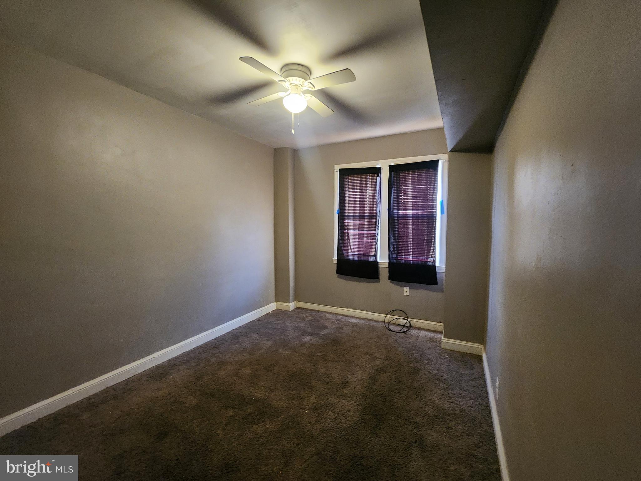 3213 Spaulding Avenue Baltimore, MD 21215 - Photo 21 of 26 an empty room with windows and fan