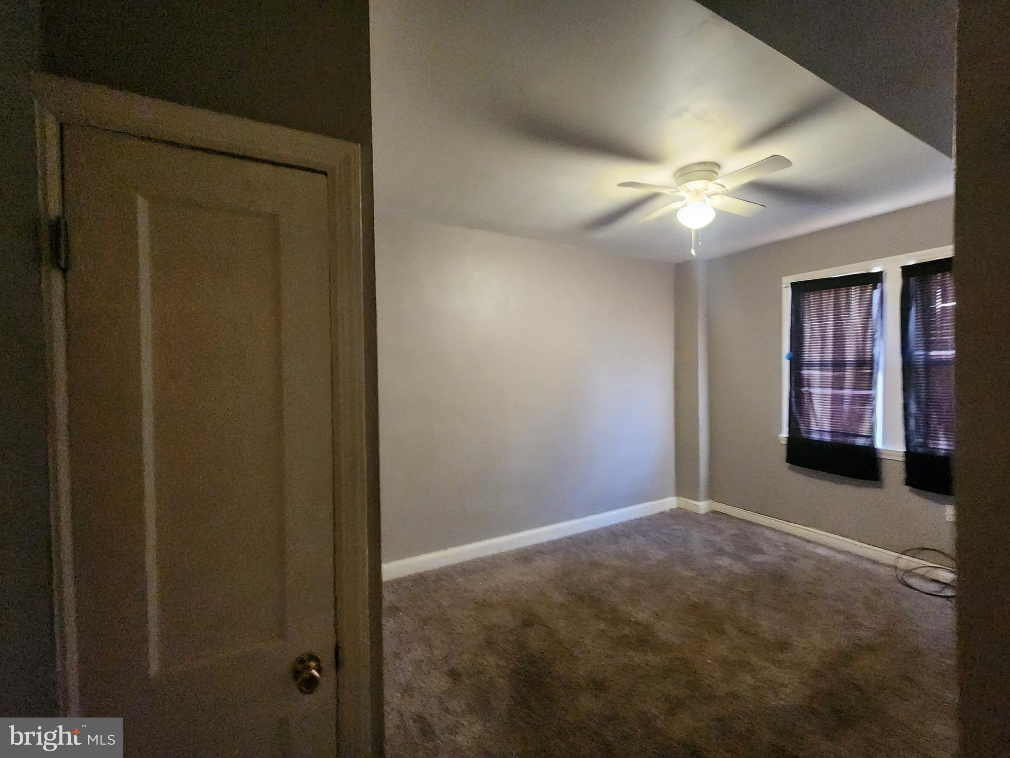 3213 Spaulding Avenue Baltimore, MD 21215 - Photo 22 of 26 an empty room with windows and fan