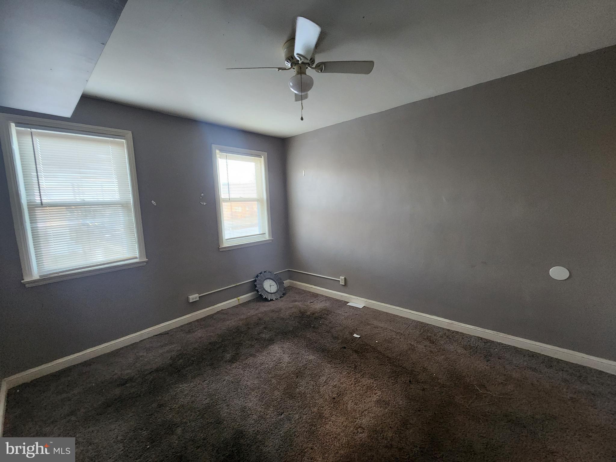 3213 Spaulding Avenue Baltimore, MD 21215 - Photo 24 of 26 an empty room with a window and a fan