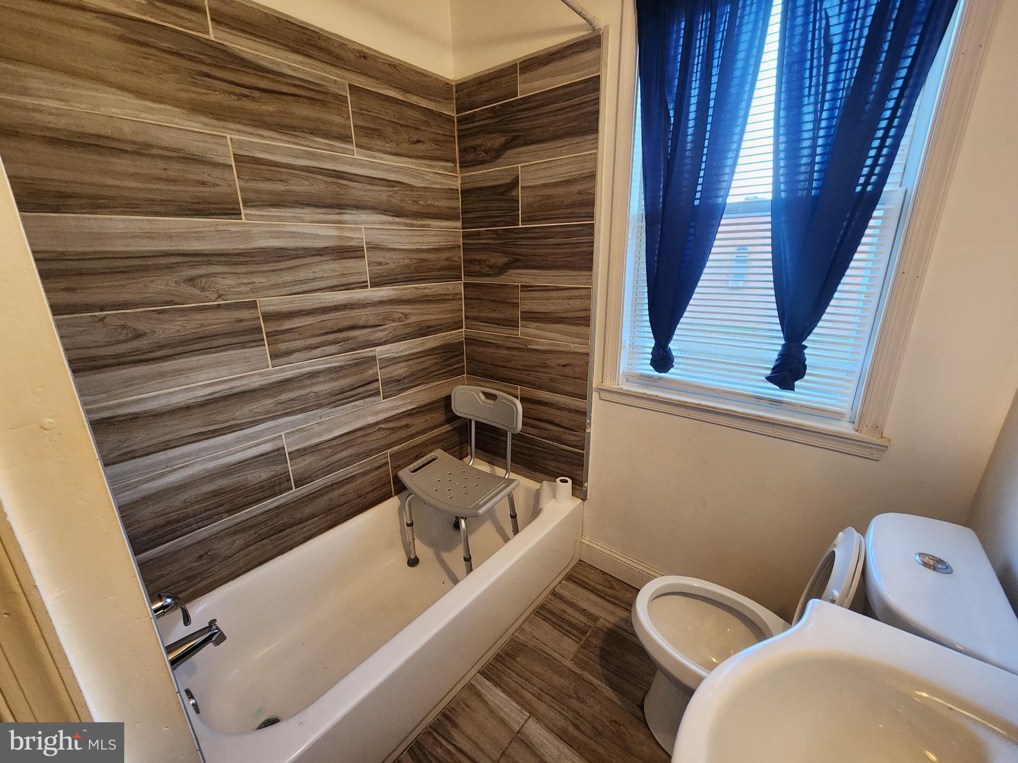 3213 Spaulding Avenue Baltimore, MD 21215 - Photo 26 of 26 a bathroom with a bathtub and shower