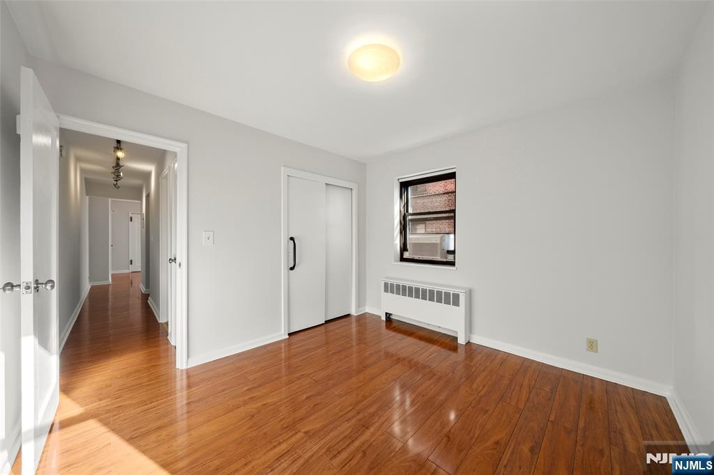 2337 Hudson Terrace, Unit C11 Fort Lee, NJ 07024 - Photo 11 of 23 wooden floor in an empty room
