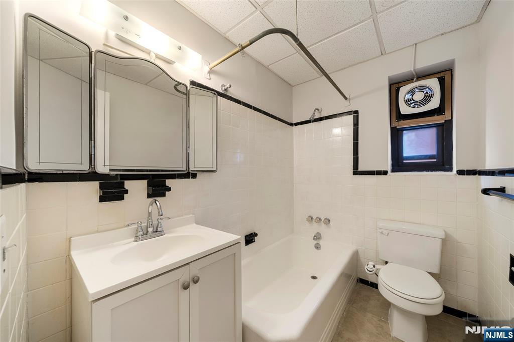 2337 Hudson Terrace, Unit C11 Fort Lee, NJ 07024 - Photo 13 of 23 a bathroom with a sink and a mirror