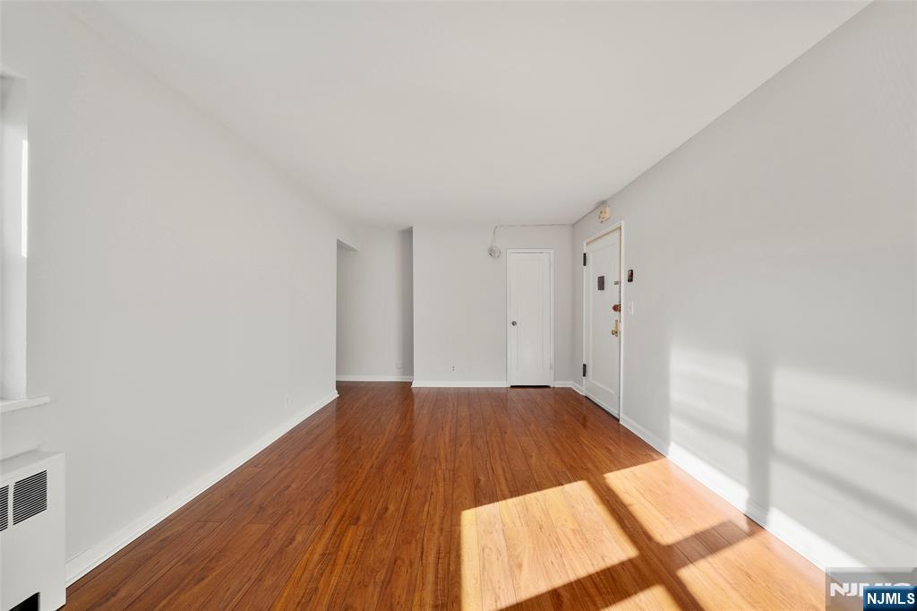2337 Hudson Terrace, Unit C11 Fort Lee, NJ 07024 - Photo 14 of 23 a view of an empty room and wooden floor