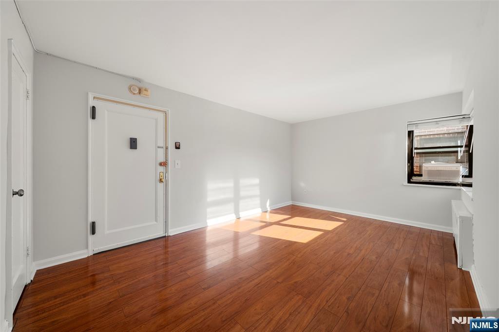 2337 Hudson Terrace, Unit C11 Fort Lee, NJ 07024 - Photo 15 of 23 a view of empty room with wooden floor