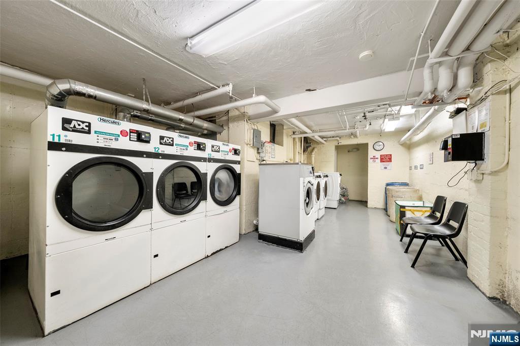 2337 Hudson Terrace, Unit C11 Fort Lee, NJ 07024 - Photo 17 of 23 a utility room with dryer washer and a view of living room