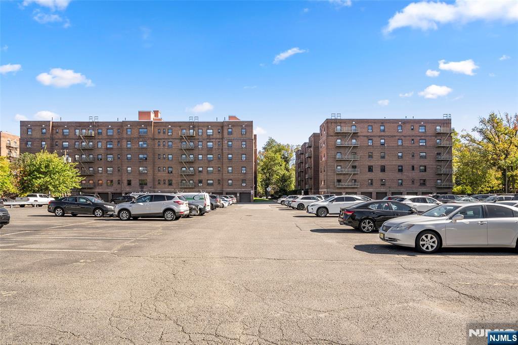 2337 Hudson Terrace, Unit C11 Fort Lee, NJ 07024 - Photo 20 of 23 a view of a cars parked in front of a building
