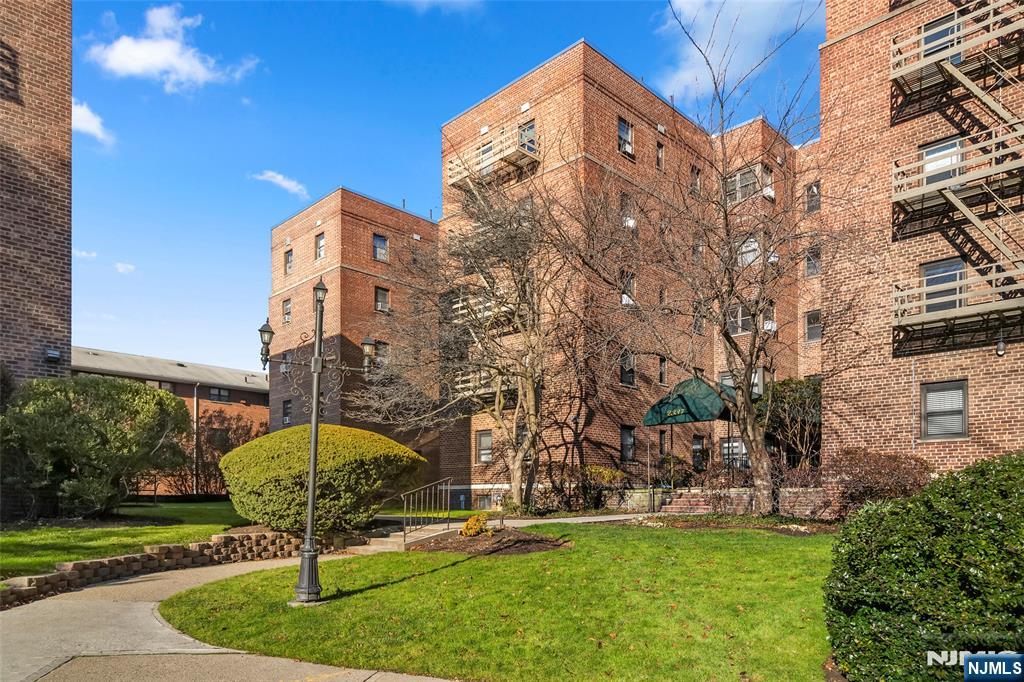 2337 Hudson Terrace, Unit C11 Fort Lee, NJ 07024 - Photo 22 of 23 a front view of a building and trees
