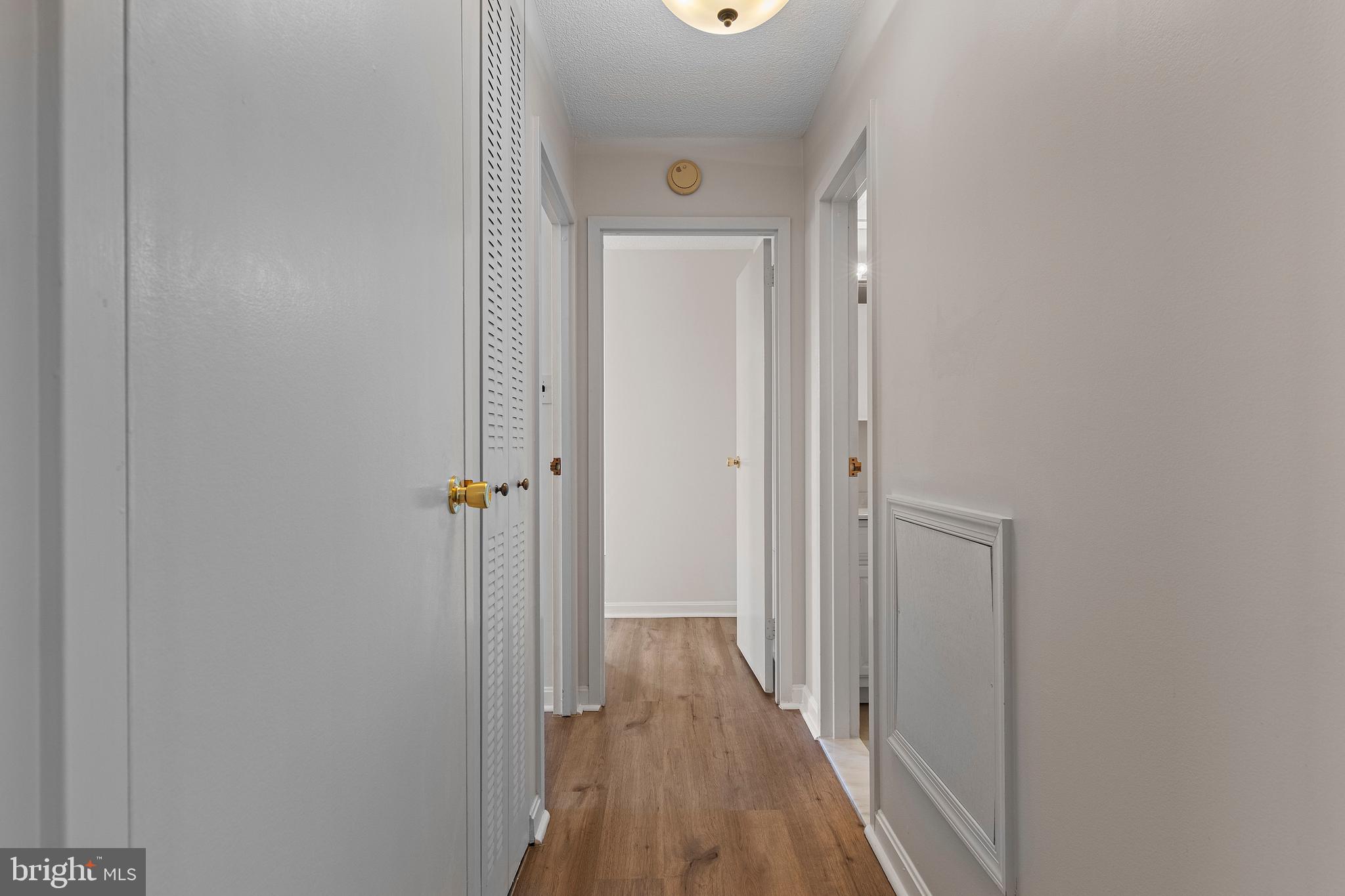 801 Yale Avenue, Unit 919 Swarthmore, PA 19081 - Photo 13 of 26 a view of a hallway with wooden floor