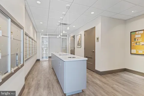 a view of a bathroom with a sink and mirror