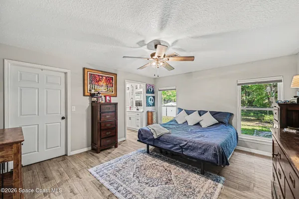 a living room with a bed and a window