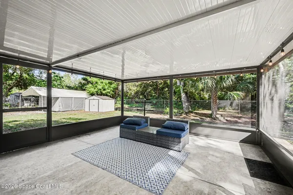 a living room with couch and a table