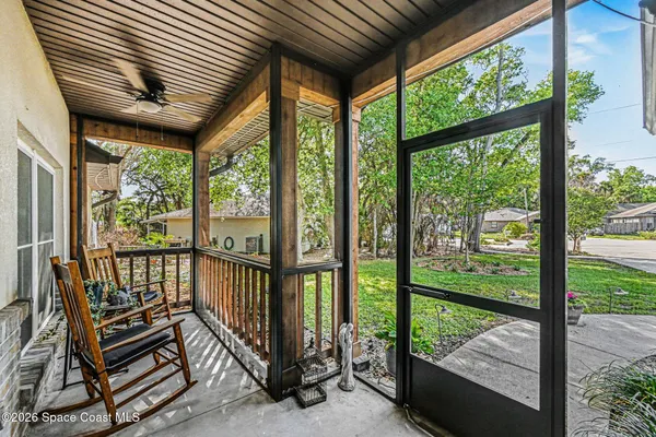 a view of a porch with wooden floor outdoor seating