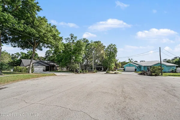 a view of a house with a yard and garage
