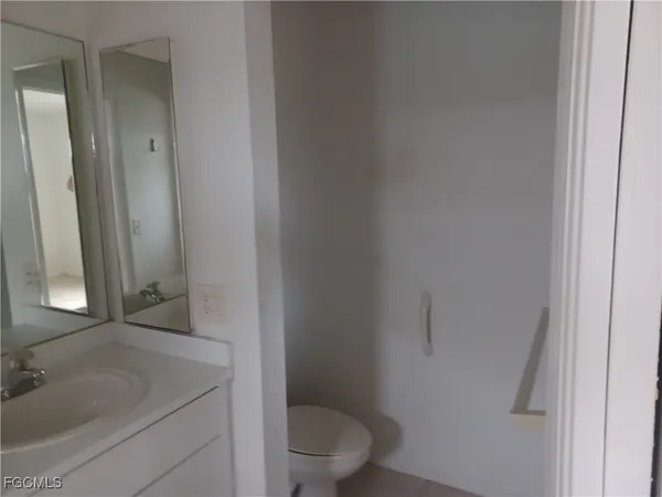 a bathroom with a sink and toilet