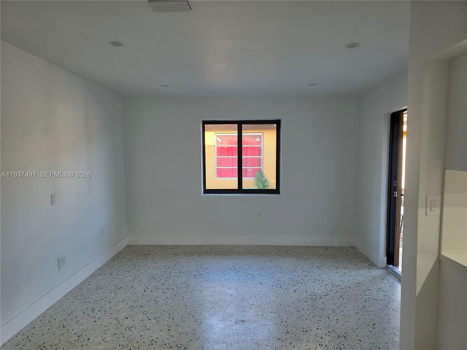 233 East 7th Street, Unit 2 Hialeah, FL 33010 - Photo 12 of 12 an empty room with windows
