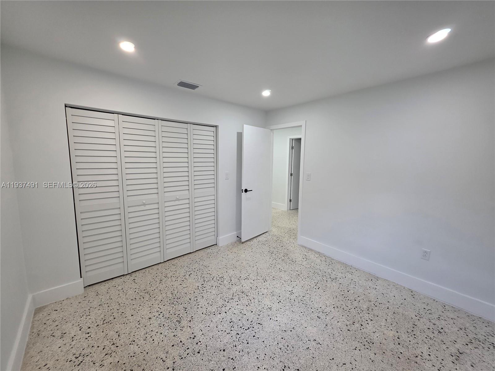 233 East 7th Street, Unit 2 Hialeah, FL 33010 - Photo 9 of 12 wooden floor in an empty room