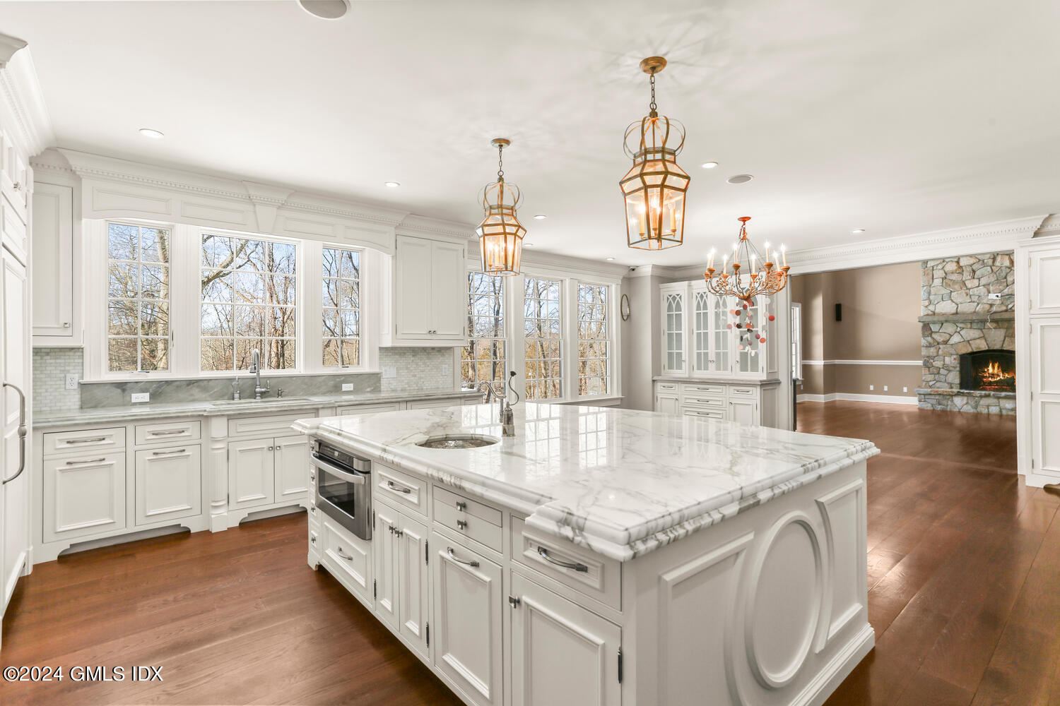 a kitchen with stainless steel appliances granite countertop a stove and a center island