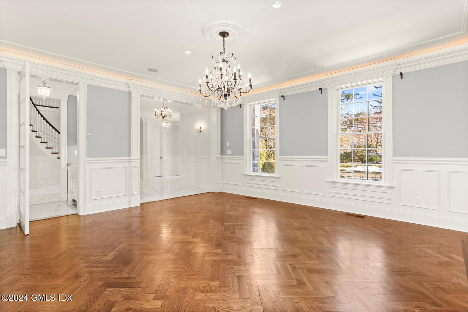 386 Westover Road Stamford, CT 06902 - Photo 12 of 32 a view of an empty room with wooden floor and a window