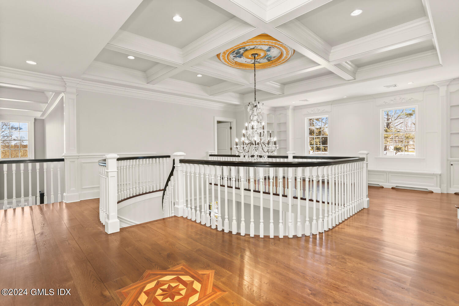 386 Westover Road Stamford, CT 06902 - Photo 14 of 32 a view of staircase with wooden floor and chandelier