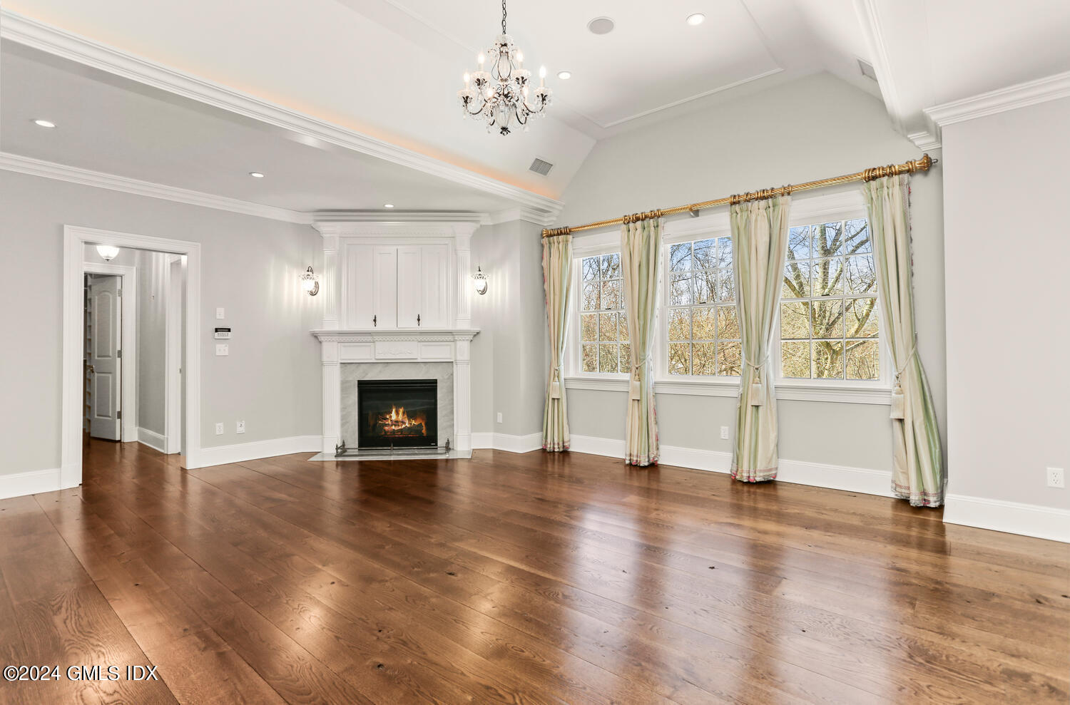386 Westover Road Stamford, CT 06902 - Photo 18 of 32 a view of an empty room with glass door and wooden floor