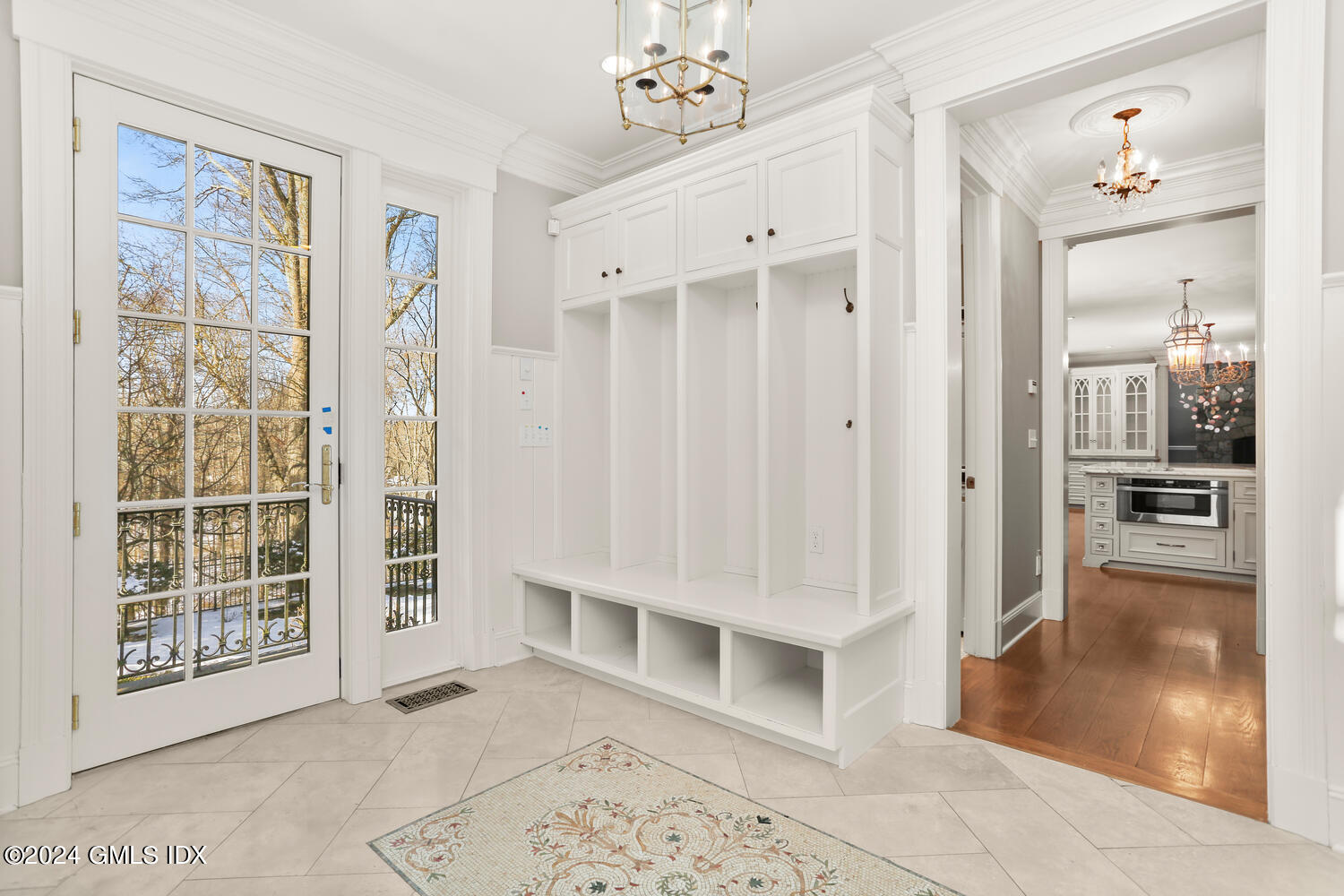 386 Westover Road Stamford, CT 06902 - Photo 24 of 32 a view of a hallway with wooden floor and a living room