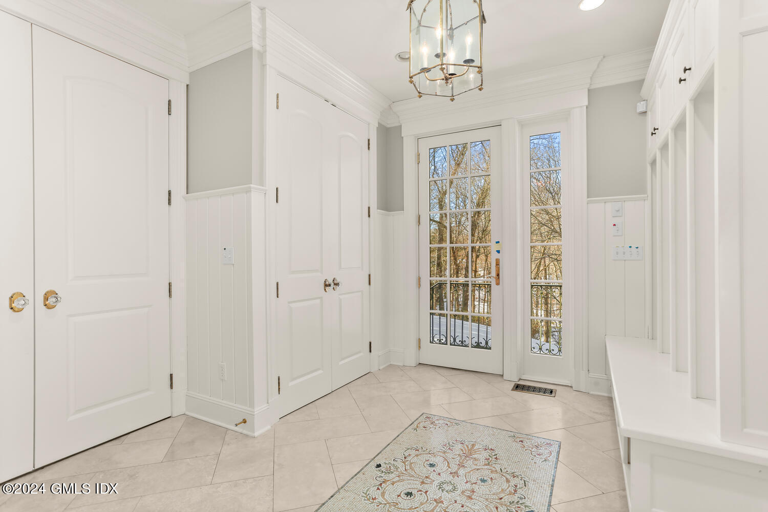 386 Westover Road Stamford, CT 06902 - Photo 25 of 32 a view of a big room with windows and chandelier