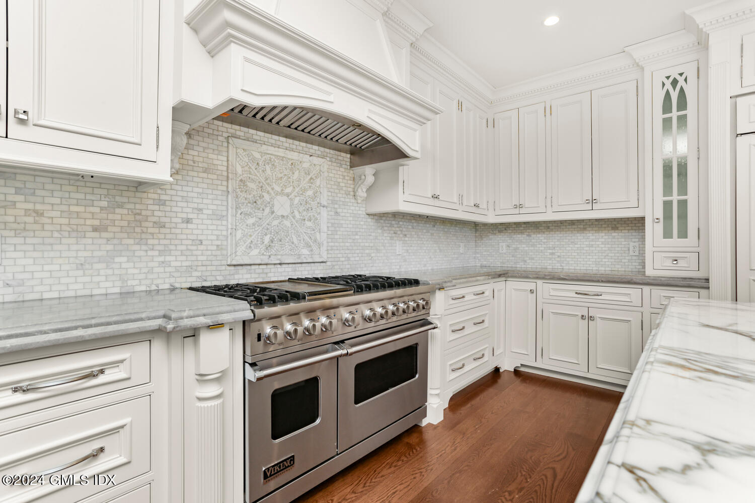 386 Westover Road Stamford, CT 06902 - Photo 3 of 32 a kitchen with granite countertop a stove and white cabinets