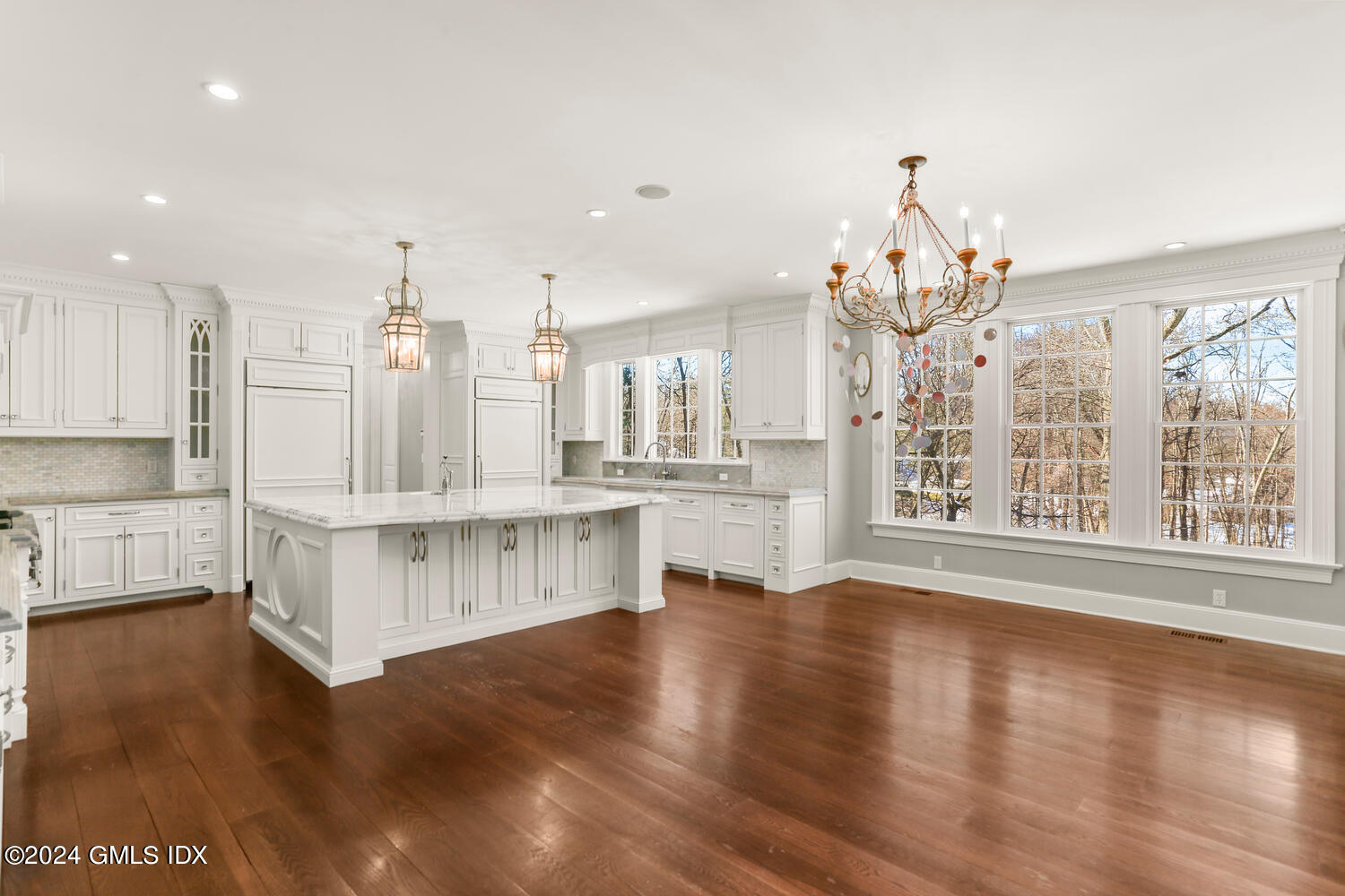 386 Westover Road Stamford, CT 06902 - Photo 5 of 32 a large white kitchen with lots of counter space wooden floor and appliances
