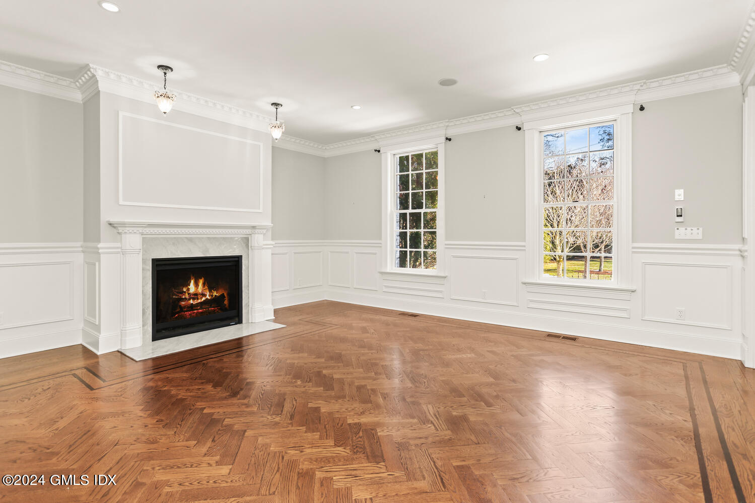 386 Westover Road Stamford, CT 06902 - Photo 10 of 32 a view of an empty room with a window and fireplace