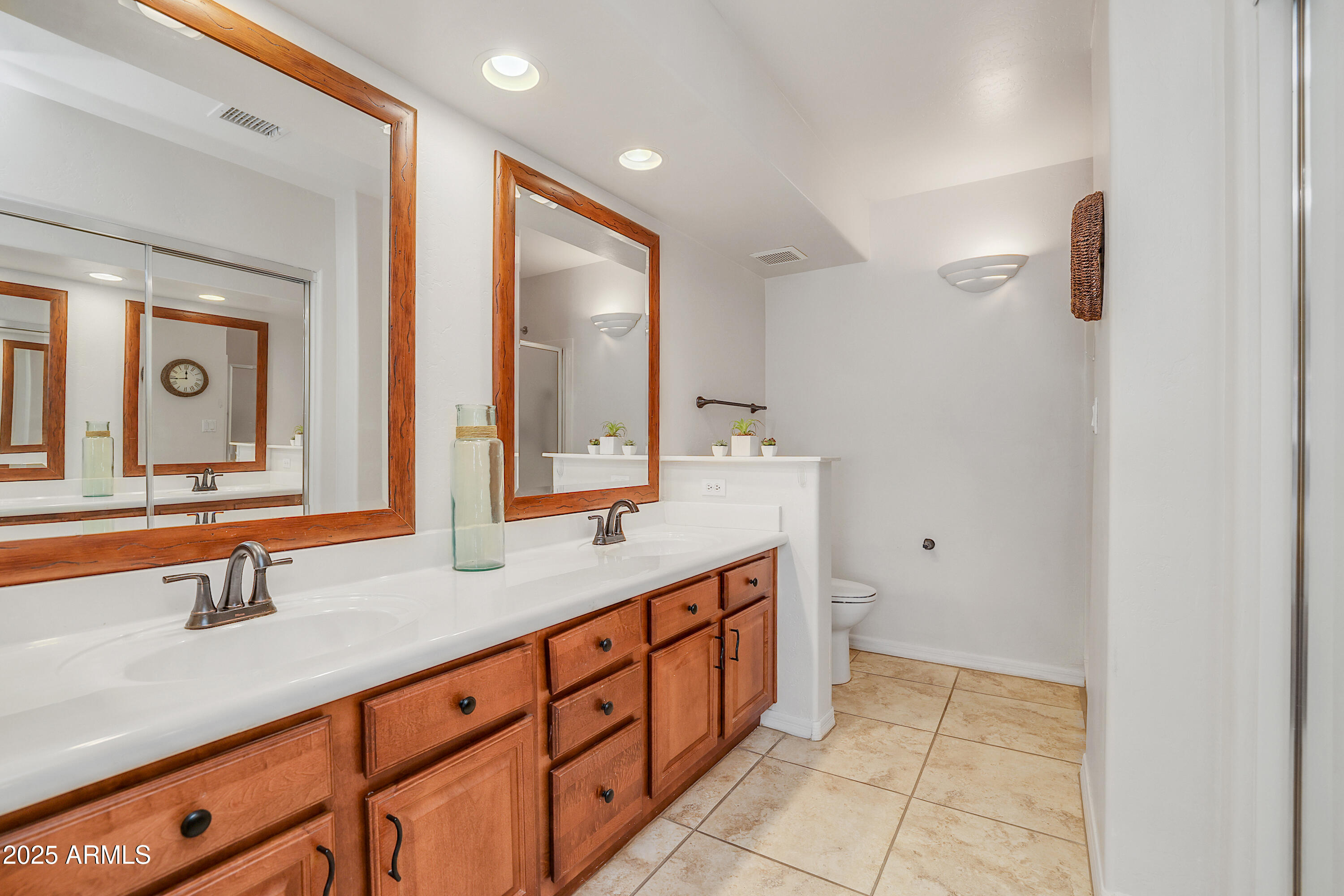 5830 East McKellips Road, Unit 30 Mesa, AZ 85215 - Photo 13 of 34 a spacious bathroom with a double vanity sink and a mirror