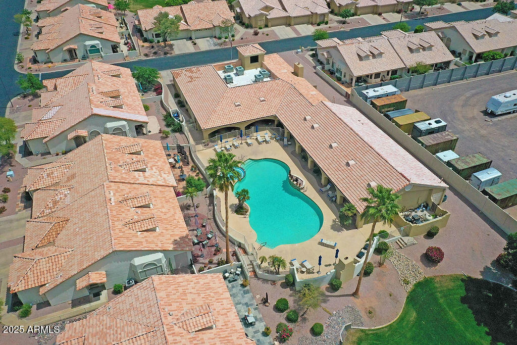 5830 East McKellips Road, Unit 30 Mesa, AZ 85215 - Photo 30 of 34 an aerial view of a house with a swimming pool and outdoor seating