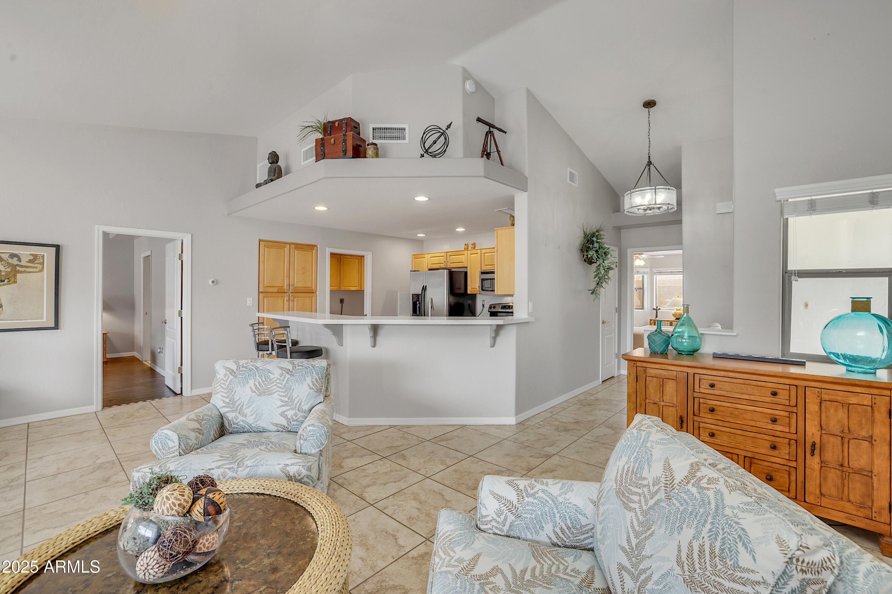 5830 East McKellips Road, Unit 30 Mesa, AZ 85215 - Photo 3 of 34 a living room with furniture and wooden floor