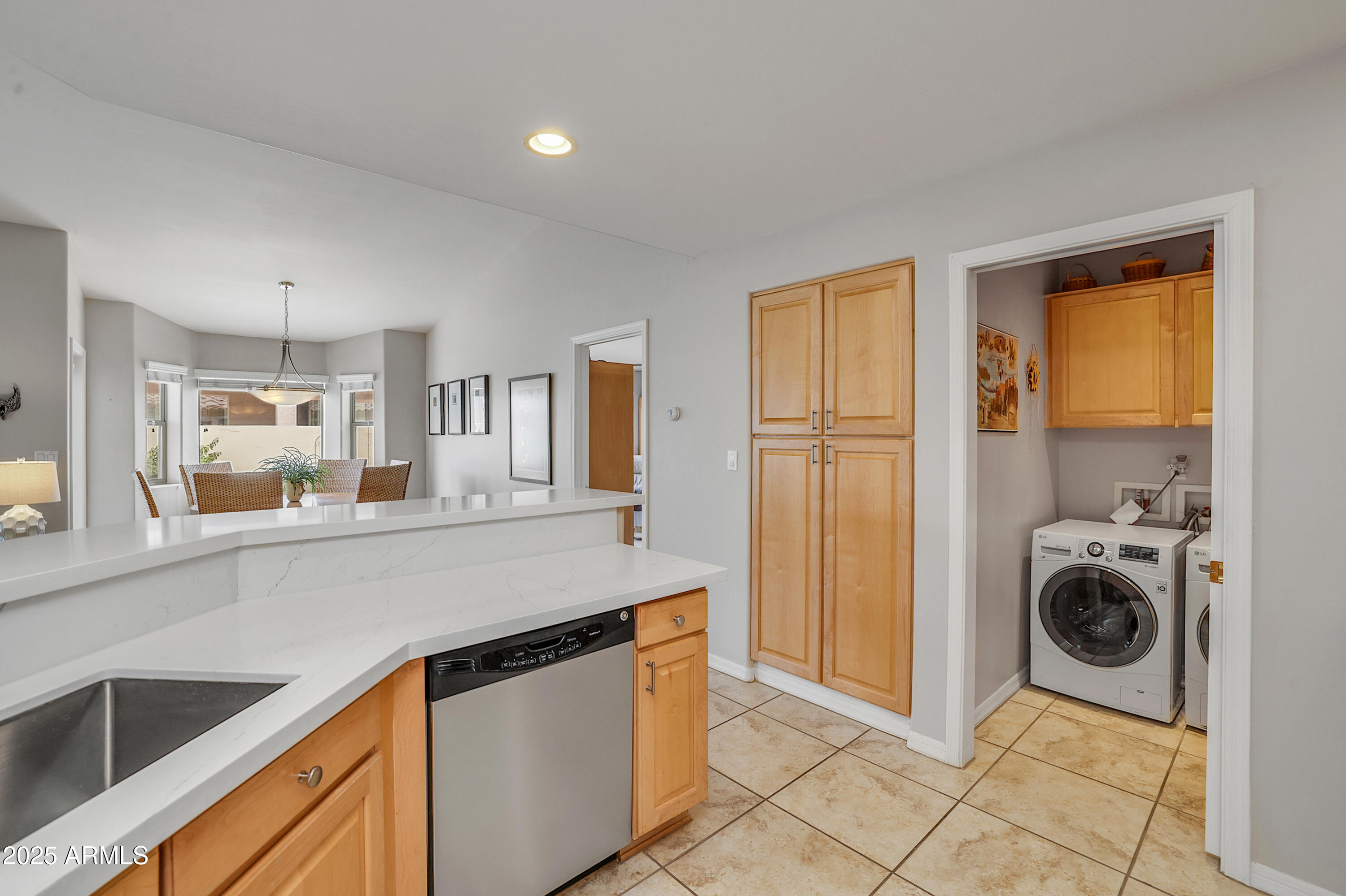 5830 East McKellips Road, Unit 30 Mesa, AZ 85215 - Photo 8 of 34 a view of a kitchen with a sink and a refrigerator