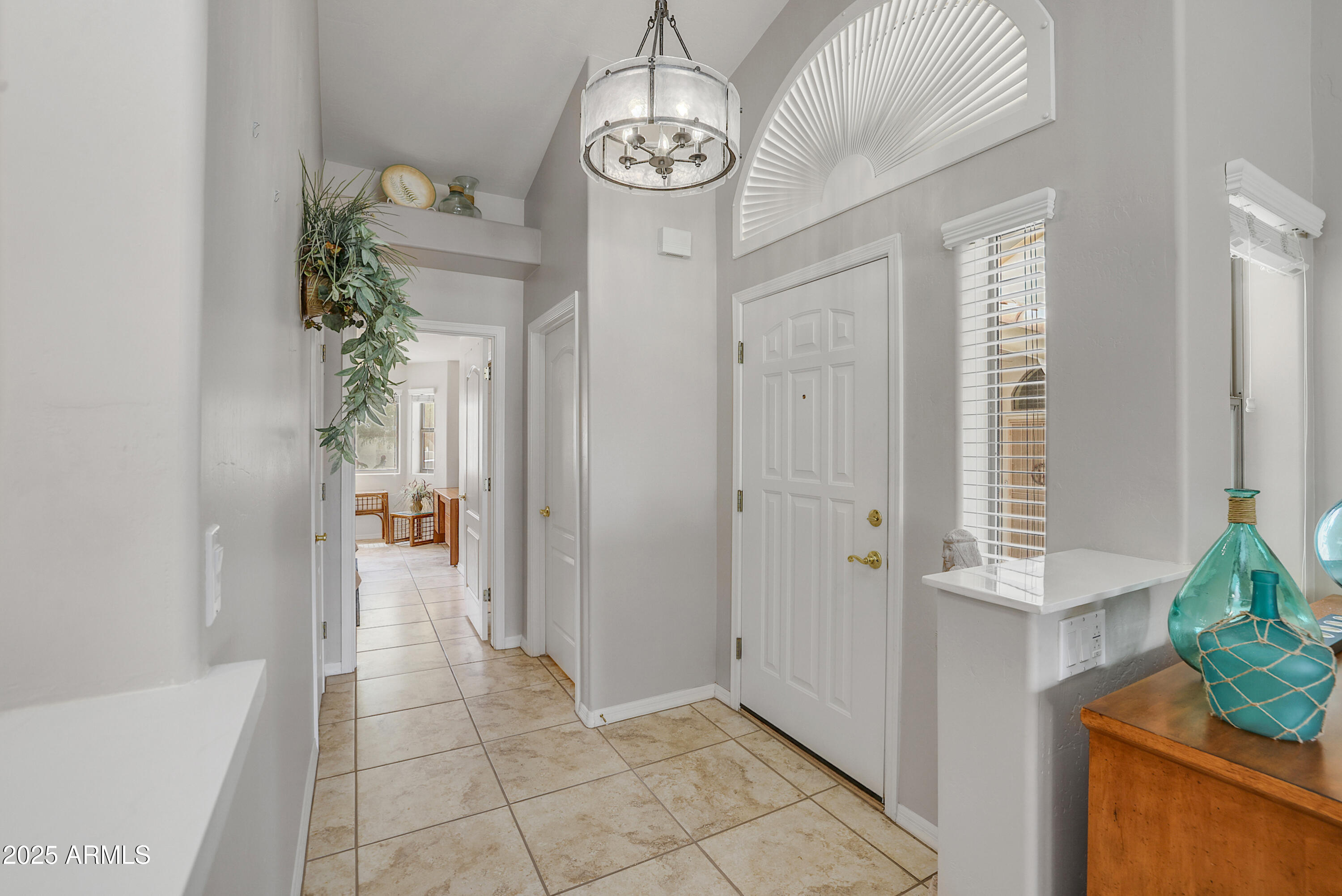 5830 East McKellips Road, Unit 30 Mesa, AZ 85215 - Photo 10 of 34 a view of entryway with chandelier