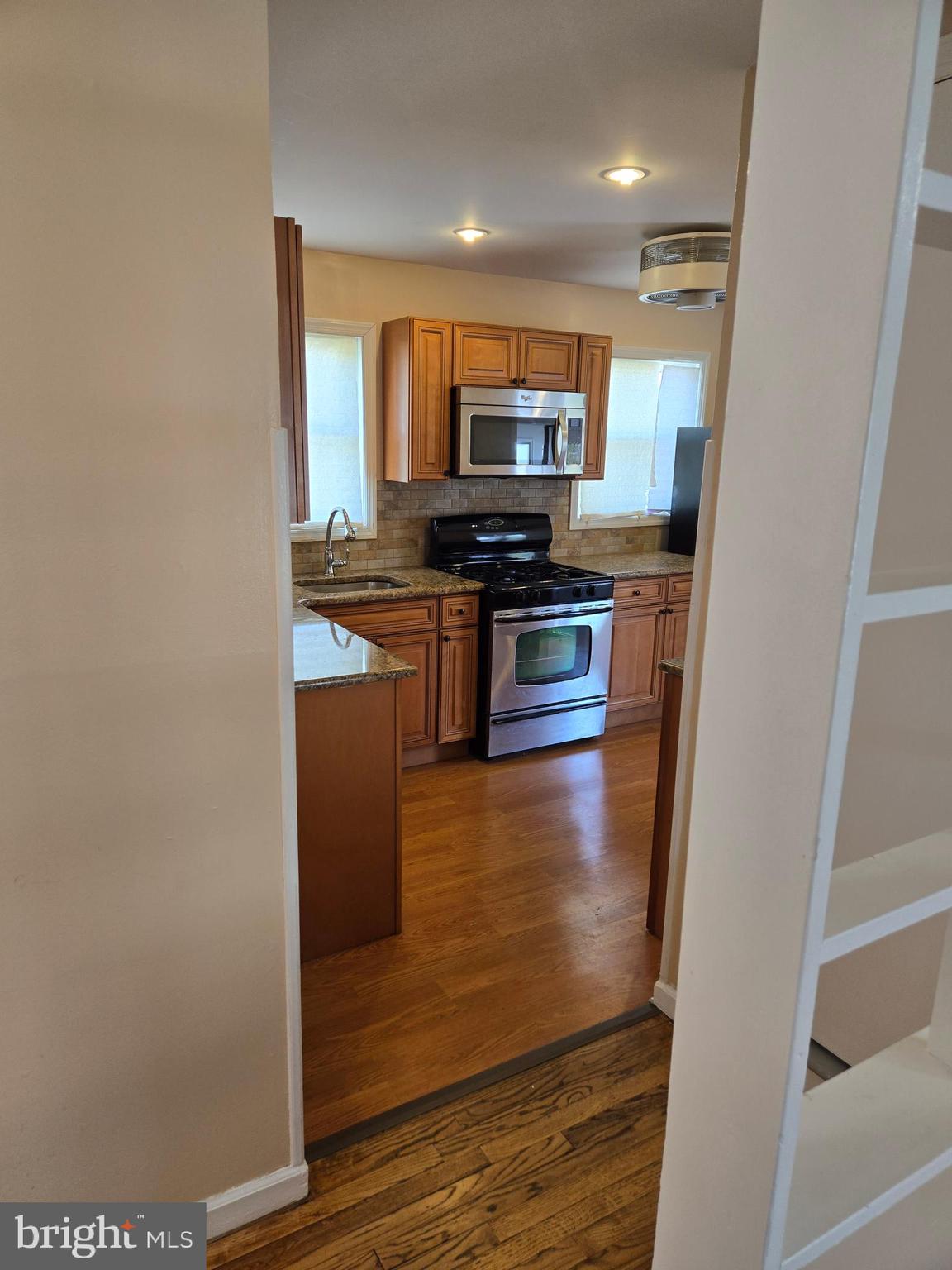 3245 Washington Road Parlin, NJ 08859 - Photo 35 of 59 a kitchen with stainless steel appliances granite countertop a refrigerator a stove top oven a sink and dishwasher